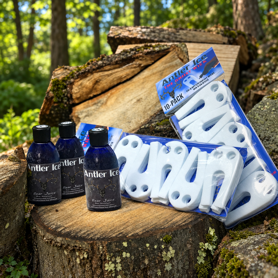 Three Antler Ice bear juice bottles and two packs of white outdoor scent wicks displayed on a tree stump in a forest setting.